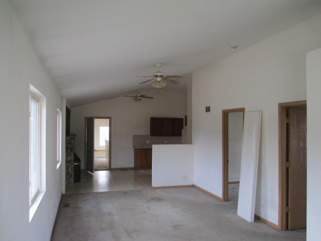 35322 North Wilson Road Ingleside, IL 60041 - Photo 3 of 18 a view of a livingroom with furniture and a flat screen tv