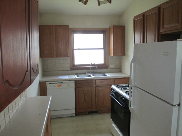 35322 North Wilson Road Ingleside, IL 60041 - Photo 9 of 18 a kitchen with stainless steel appliances granite countertop a refrigerator sink and stove