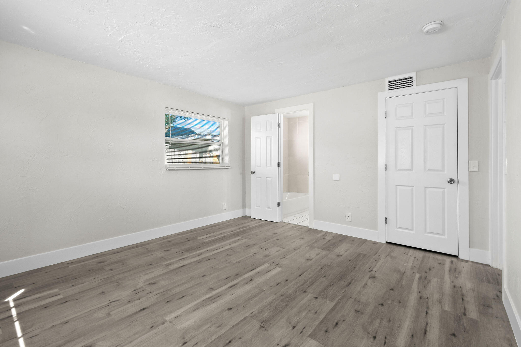 1301 West 25th Street Riviera Beach, FL 33404 - Photo 16 of 34 wooden floor in an empty room