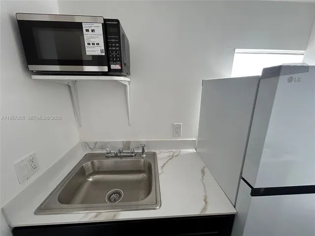 a bathroom with a sink and mirror