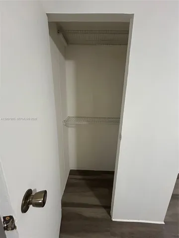 a view of staircase with white walls