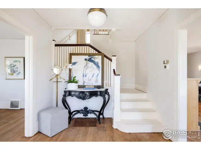 a view of entryway dining room and hall with wooden floor