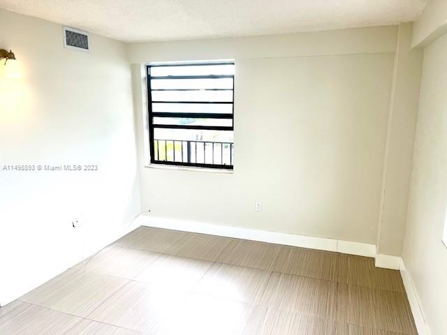 777 Southwest 9th Avenue, Unit 413 Miami, FL 33130 - Photo 16 of 36 a view of a room with wooden floor