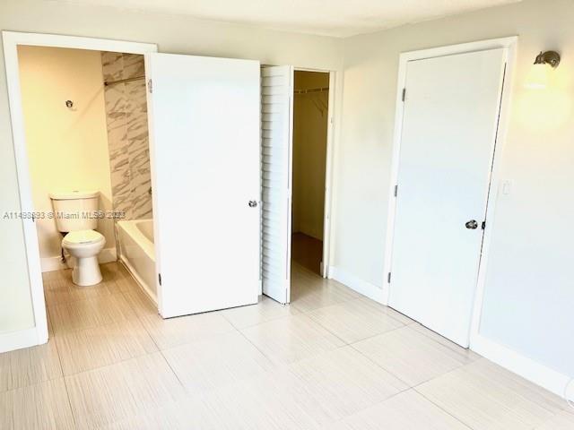777 Southwest 9th Avenue, Unit 413 Miami, FL 33130 - Photo 18 of 36 a bathroom with a sink and a toilet