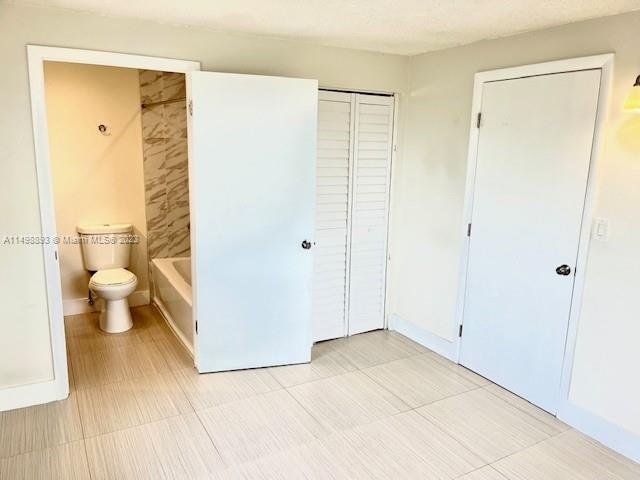777 Southwest 9th Avenue, Unit 413 Miami, FL 33130 - Photo 19 of 36 a view of a bathroom with a shower