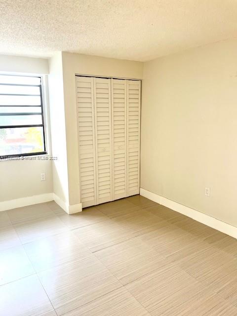 777 Southwest 9th Avenue, Unit 413 Miami, FL 33130 - Photo 22 of 36 an empty room with a empty space and windows