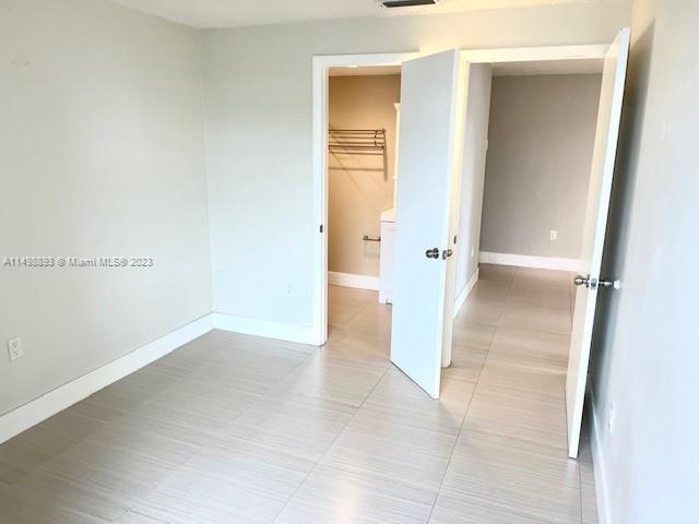 777 Southwest 9th Avenue, Unit 413 Miami, FL 33130 - Photo 24 of 36 an empty room with a bathroom and a sink