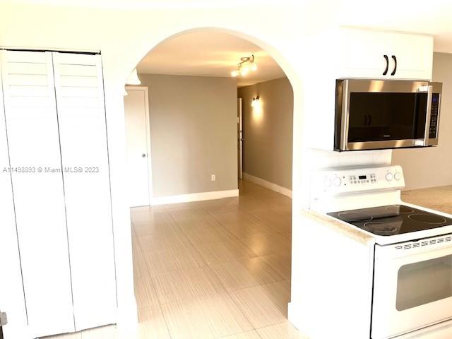 777 Southwest 9th Avenue, Unit 413 Miami, FL 33130 - Photo 5 of 36 a view of a kitchen from a empty room