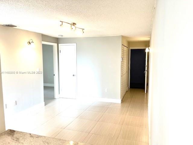 777 Southwest 9th Avenue, Unit 413 Miami, FL 33130 - Photo 8 of 36 a view of a hallway with wooden floor
