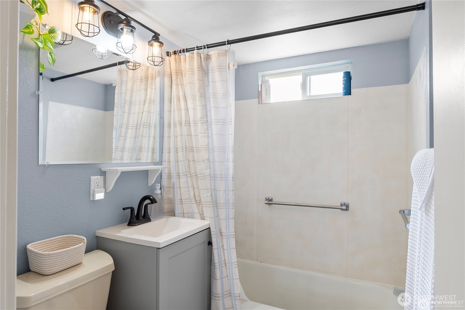 1770 Marker Avenue Wenatchee, WA 98801 - Photo 13 of 32 a bathroom with a sink a toilet and shower