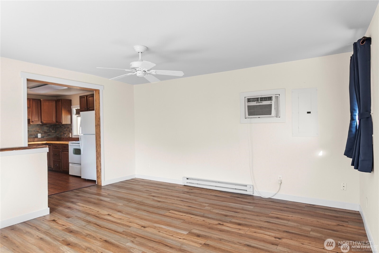 1770 Marker Avenue Wenatchee, WA 98801 - Photo 2 of 32 a view of a kitchen with wooden floor and a ceiling fan