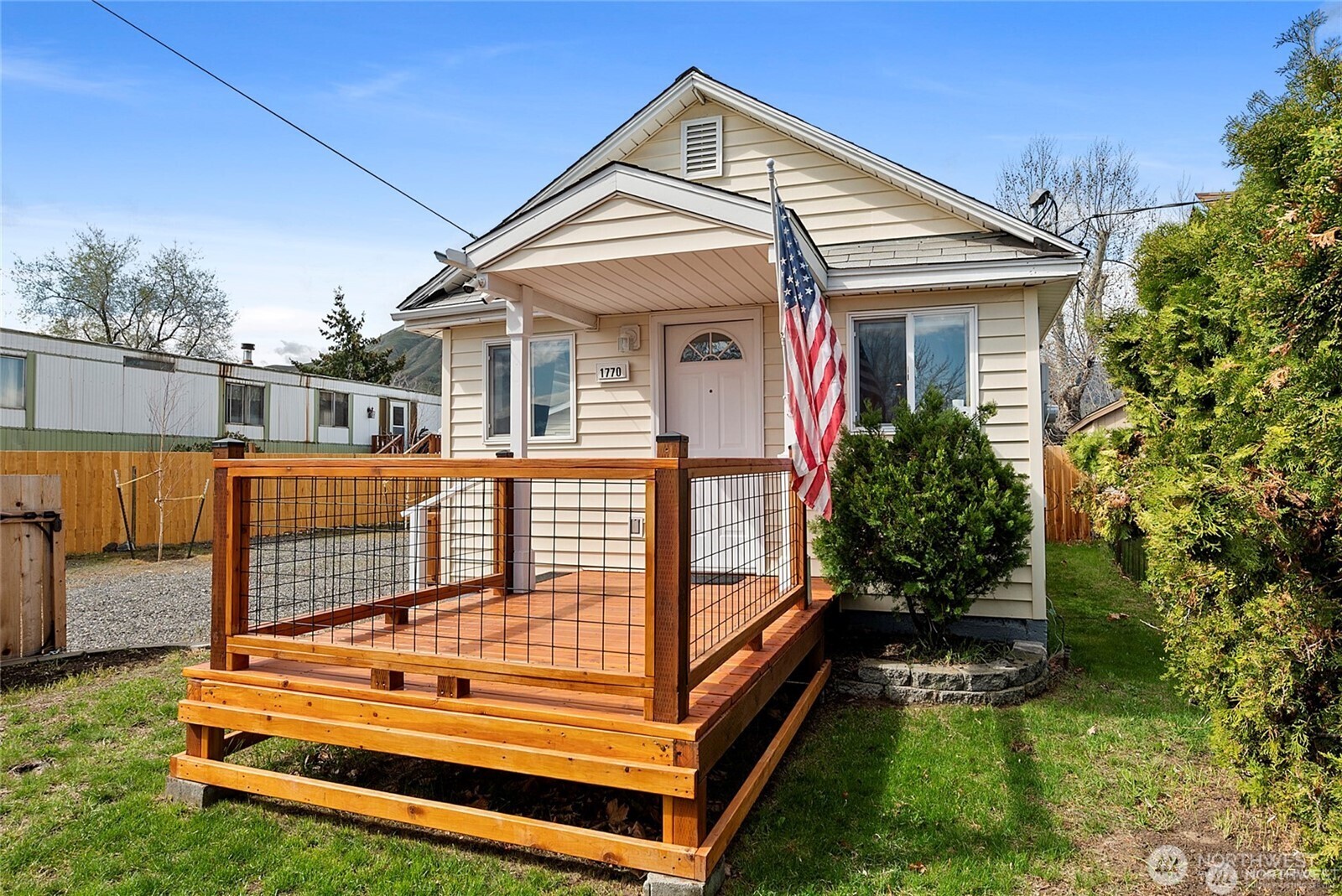 1770 Marker Avenue Wenatchee, WA 98801 - Photo 24 of 32 a view of a house with a small yard and wooden fence