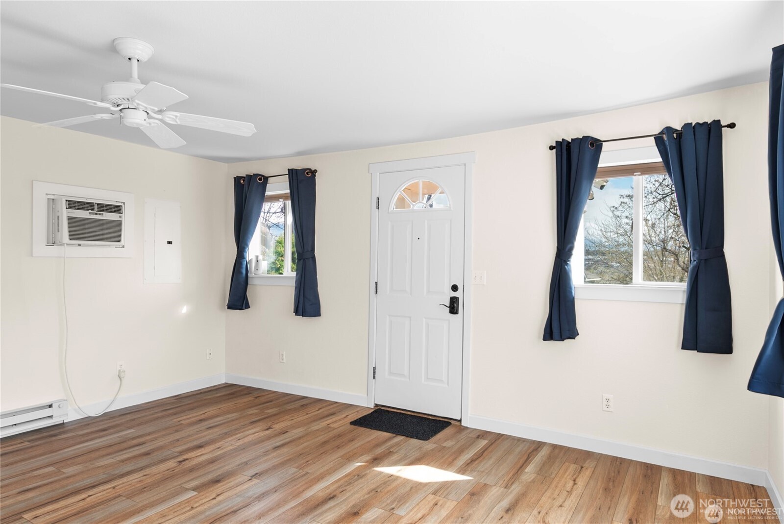 1770 Marker Avenue Wenatchee, WA 98801 - Photo 3 of 32 a view of empty room with wooden floor and fan
