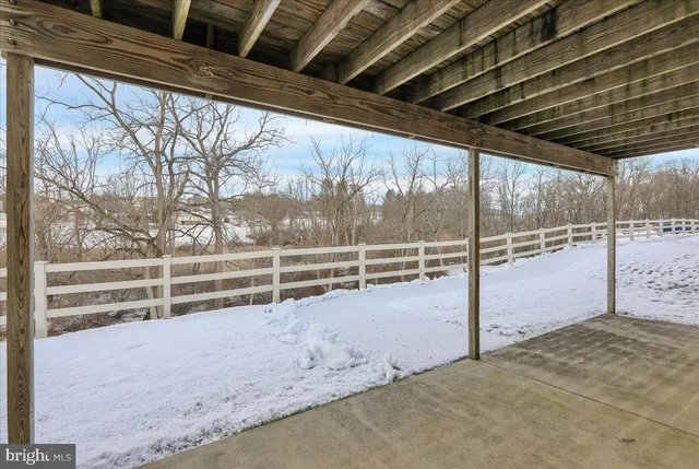 a view of outdoor space with wooden fence