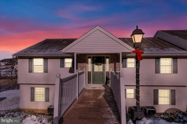 a front view of a house with yard