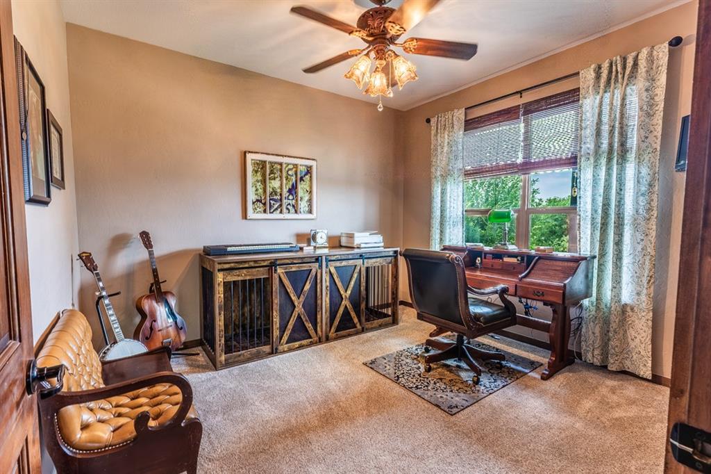 7060 Hells Gate Loop Strawn, TX 76475 - Photo 9 of 40 a view of a workspace with furniture and a window