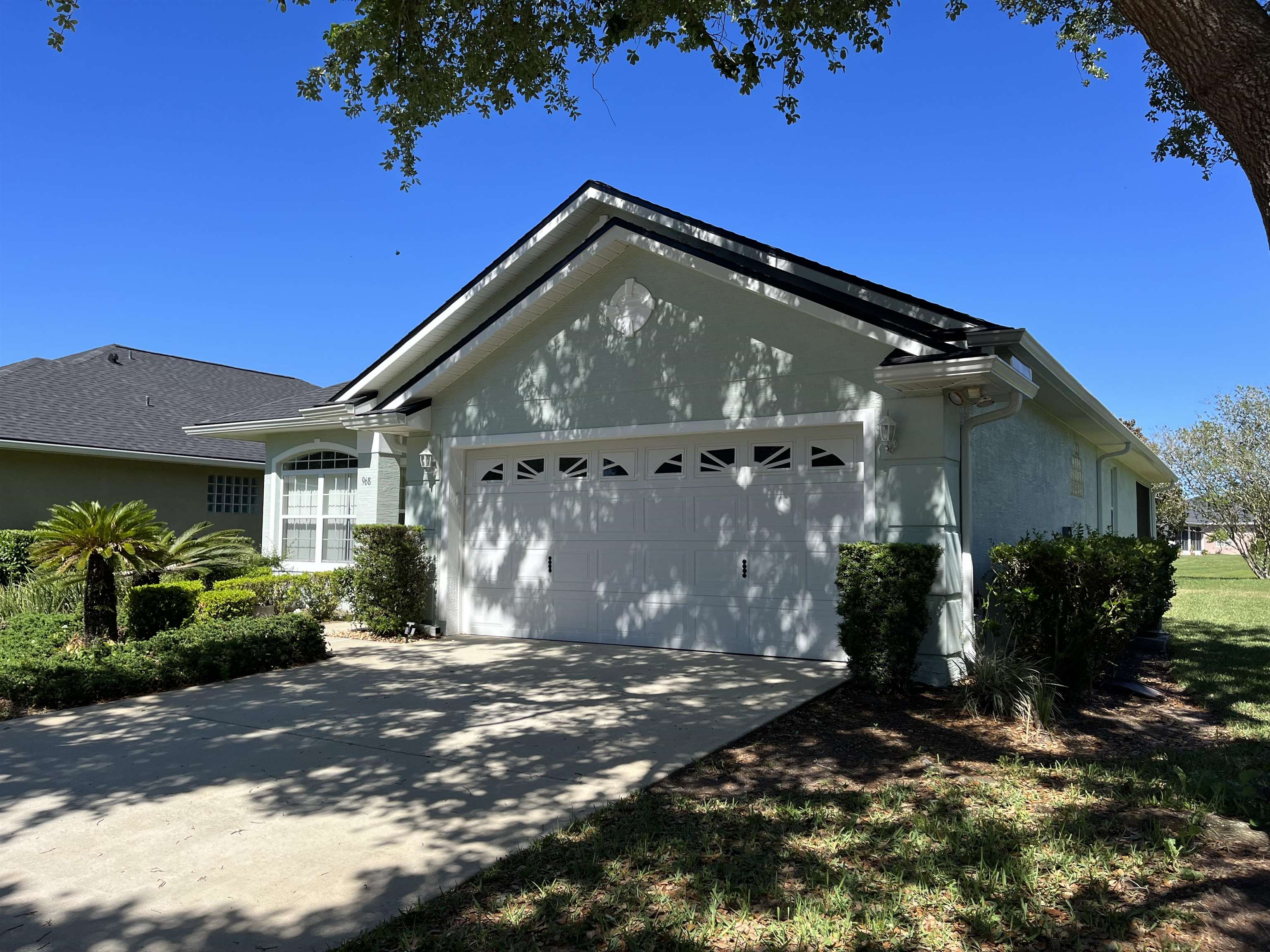 968 Ridgewood Lane St. Augustine, FL 32086 - Photo 3 of 26 View of property exterior featuring a garage