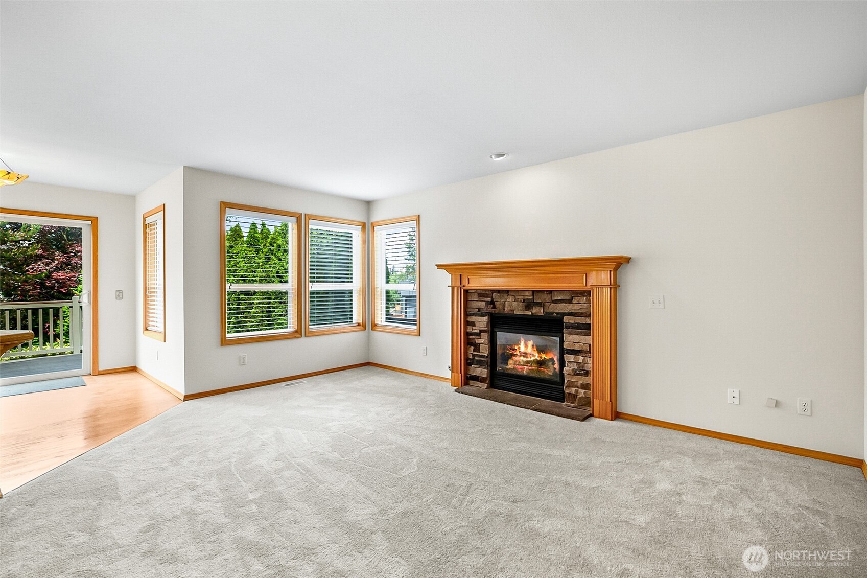 18410 11th Drive Southeast Bothell, WA 98012 - Photo 15 of 40 an empty room with a fireplace and a floor to ceiling window
