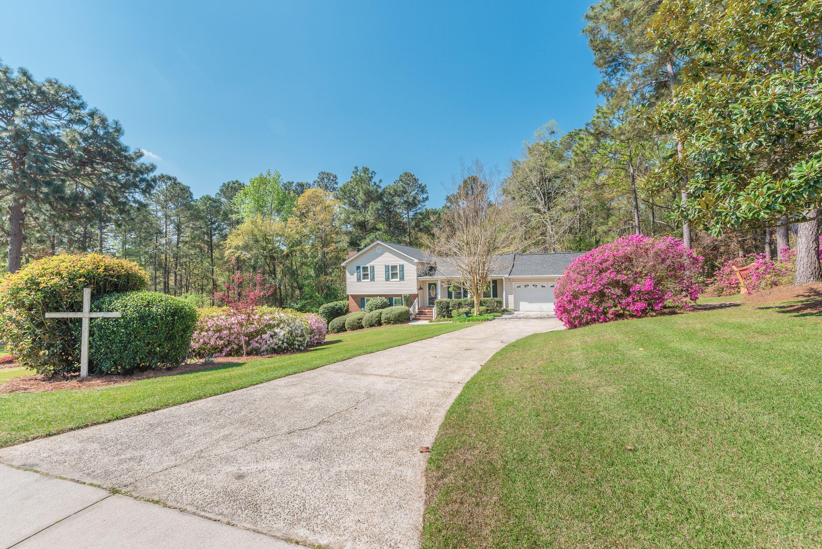 1117 Ridgemont Drive Aiken, SC 29803 - Photo 43 of 49 a front view of a house with garden