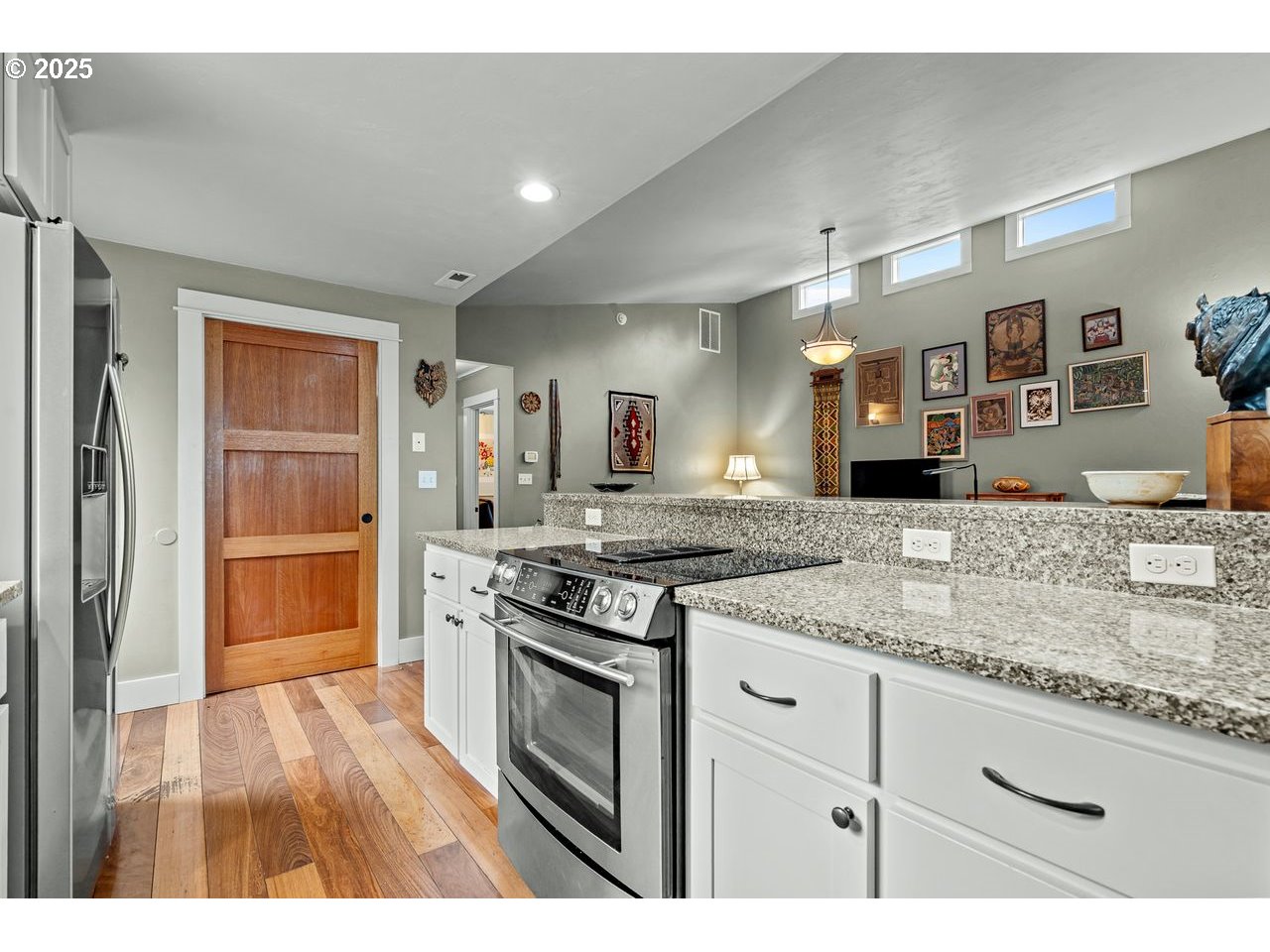 24781 Dunham Road Veneta, OR 97487 - Photo 11 of 22 a kitchen with stainless steel appliances granite countertop a stove and a sink