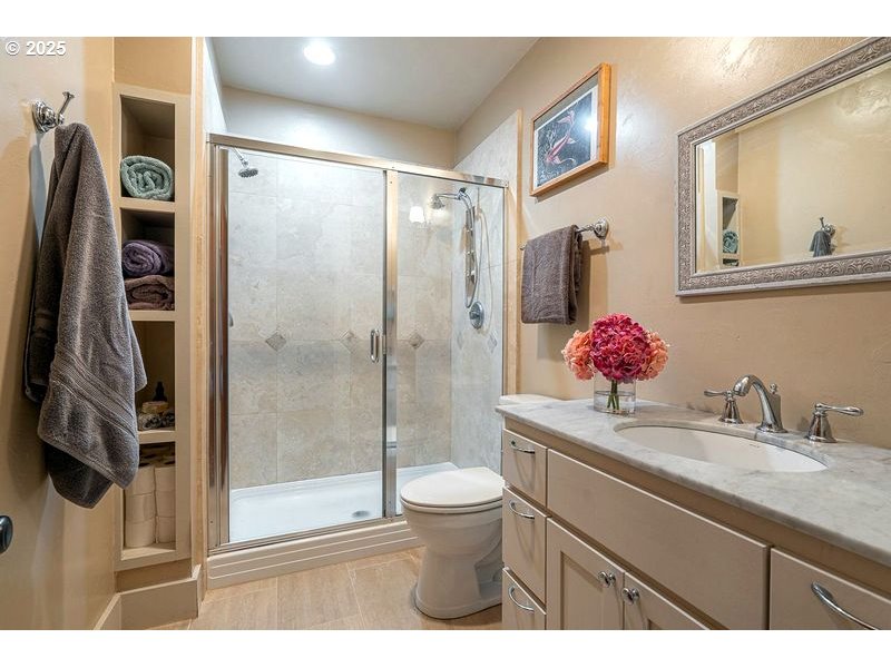 24781 Dunham Road Veneta, OR 97487 - Photo 14 of 22 a bathroom with a granite countertop sink toilet and shower