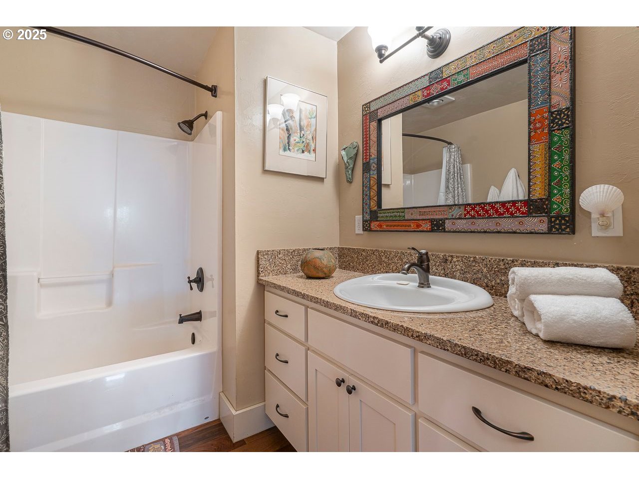 24781 Dunham Road Veneta, OR 97487 - Photo 16 of 22 a bathroom with a granite countertop sink mirror and a bathtub