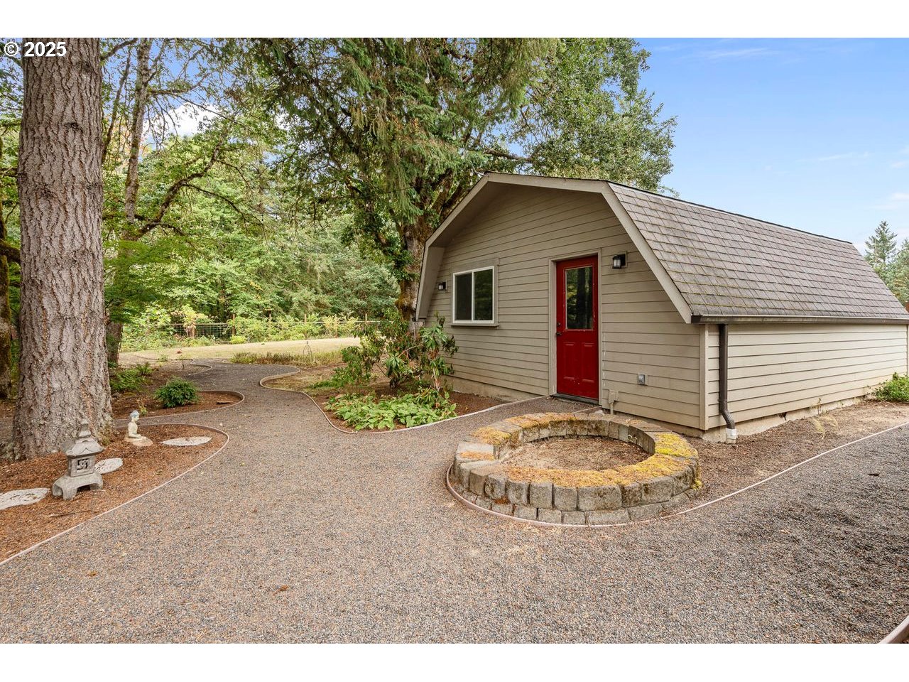 24781 Dunham Road Veneta, OR 97487 - Photo 19 of 22 a view of a wooden house with a yard and large trees