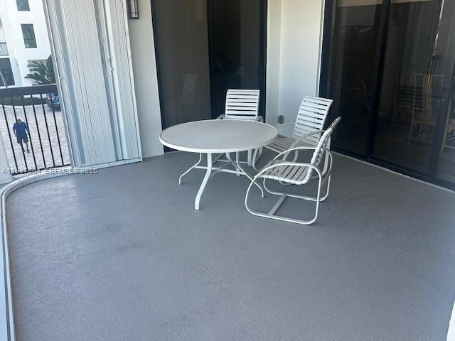 19670 South Beach Road, Unit B323 Tequesta, FL 33469 - Photo 26 of 31 a dining room with furniture and a window