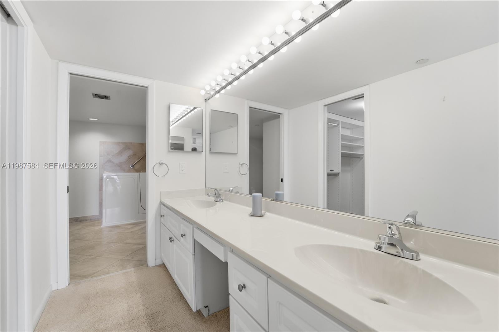 19670 South Beach Road, Unit B323 Tequesta, FL 33469 - Photo 26 of 57 a spacious bathroom with a double vanity sink mirror and double
