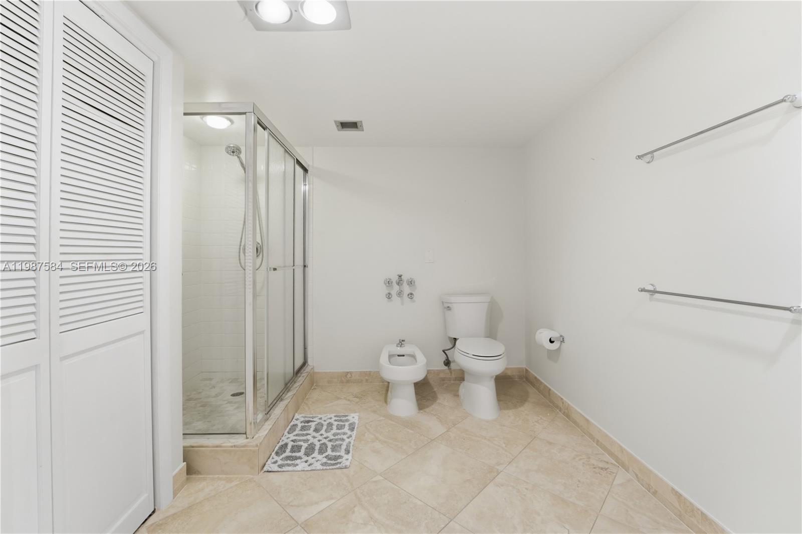 19670 South Beach Road, Unit B323 Tequesta, FL 33469 - Photo 27 of 57 a bathroom with a toilet and a shower