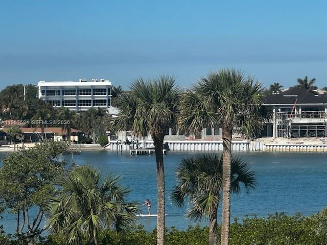 19670 South Beach Road, Unit B323 Tequesta, FL 33469 - Photo 28 of 31 a view of a swimming pool with seating space