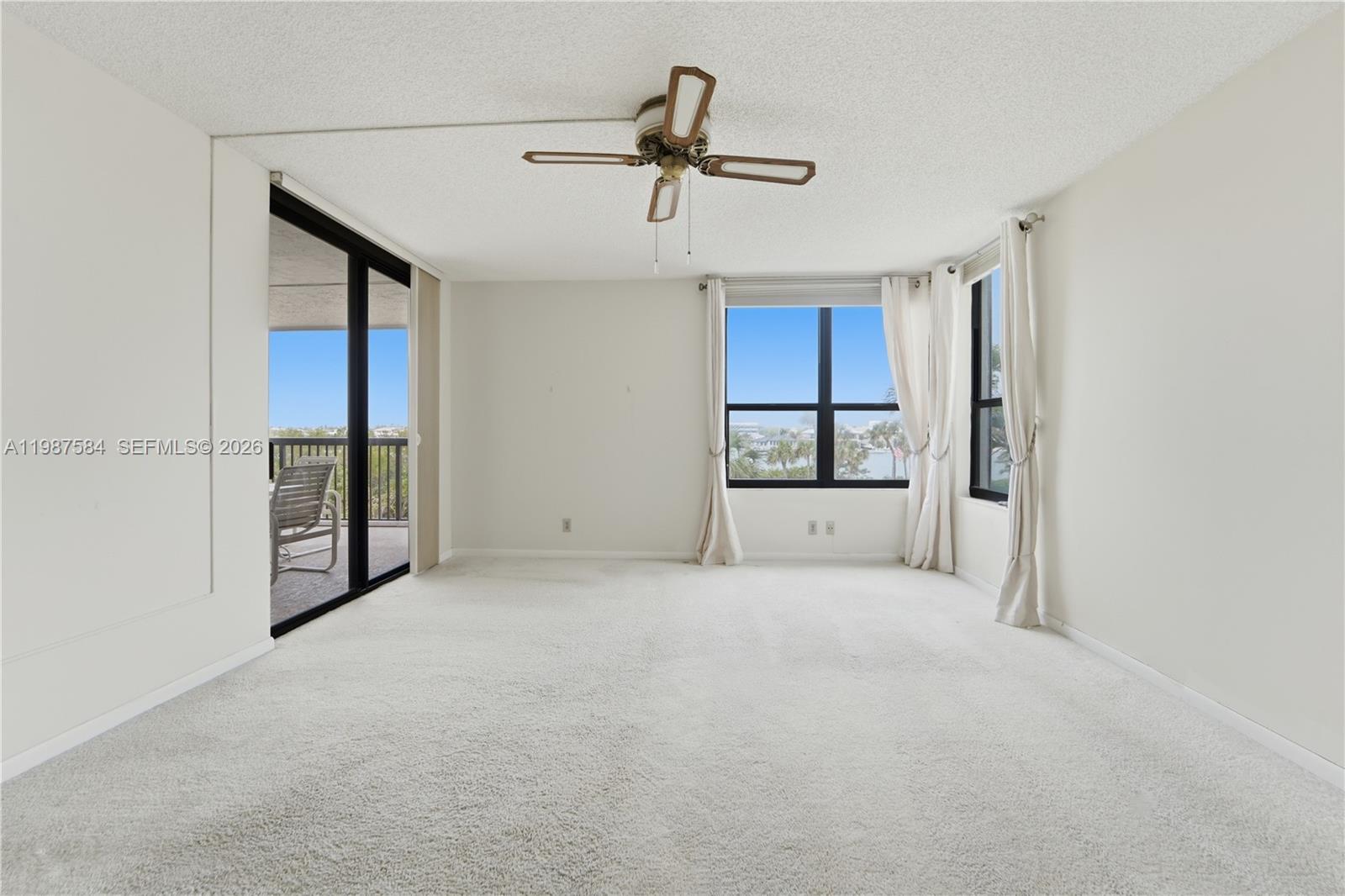 19670 South Beach Road, Unit B323 Tequesta, FL 33469 - Photo 30 of 57 a view of an empty room with a cabinet and a window