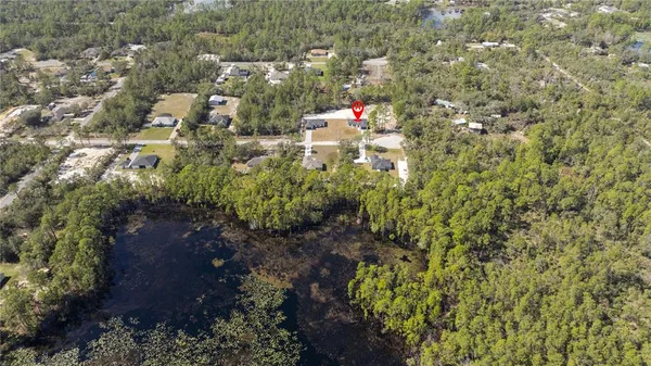 an aerial view of house with yard and mountain