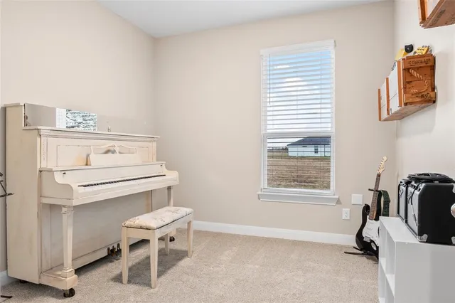 a bathroom with a toilet a sink and a window