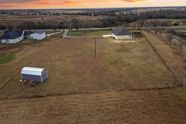 a view of a lake with a yard