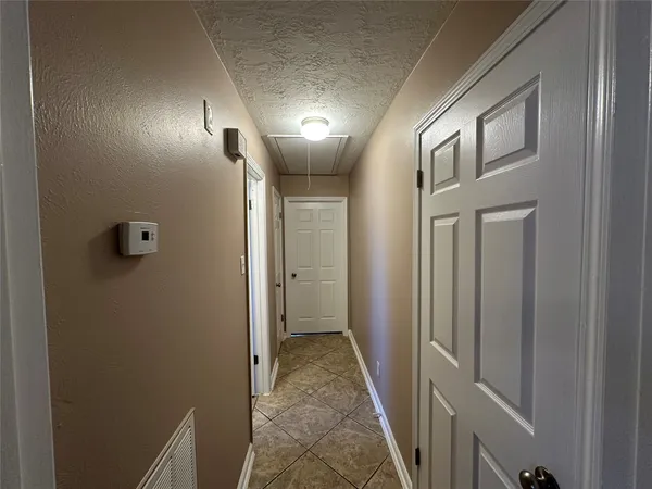 a view of hallway with a mirror