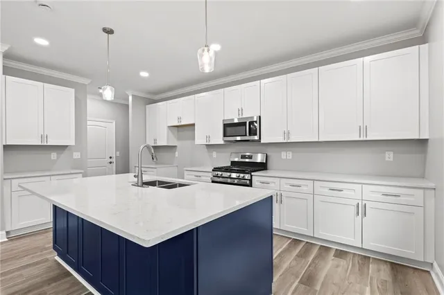 a kitchen with kitchen island white cabinets appliances and cabinets