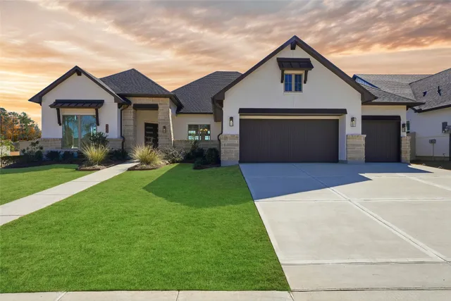 a front view of house with yard and green space