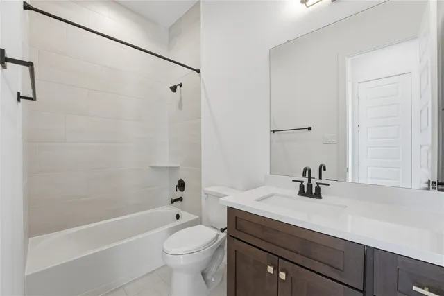 a bathroom with a sink a toilet and a bathtub