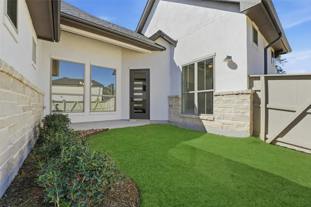 a view of front door and yard