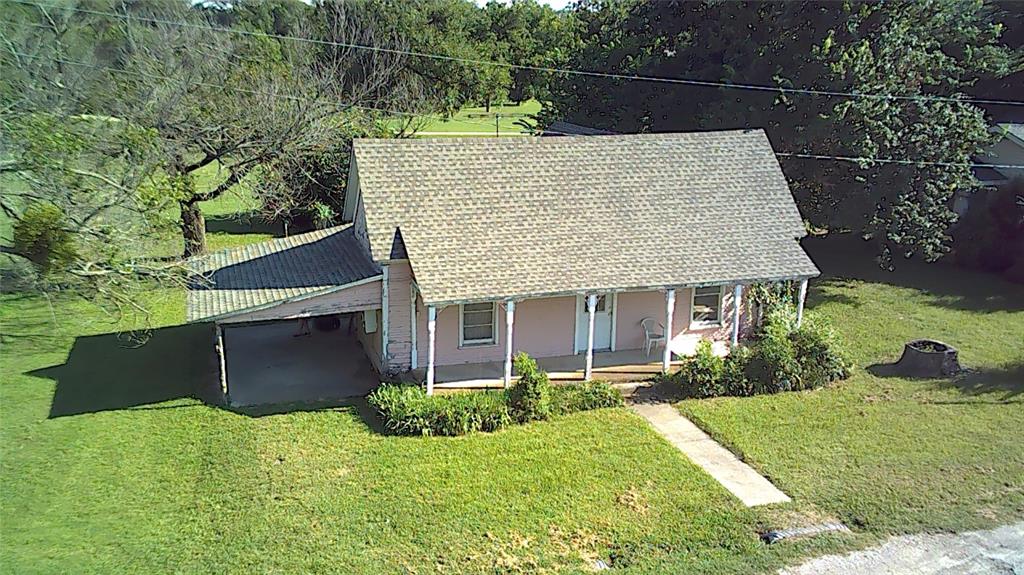 208 Optimist Springtown, TX 76082 - Photo 2 of 11 front view of house with a yard