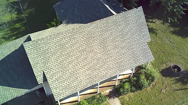 a view of house with a big yard