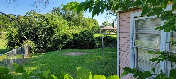 a view of a yard with an outdoor seating and mountain view