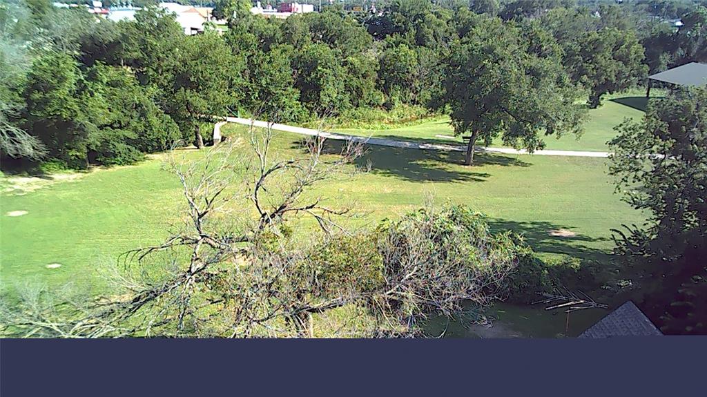 208 Optimist Springtown, TX 76082 - Photo 9 of 11 a view of a yard with an outdoor seating and mountain view