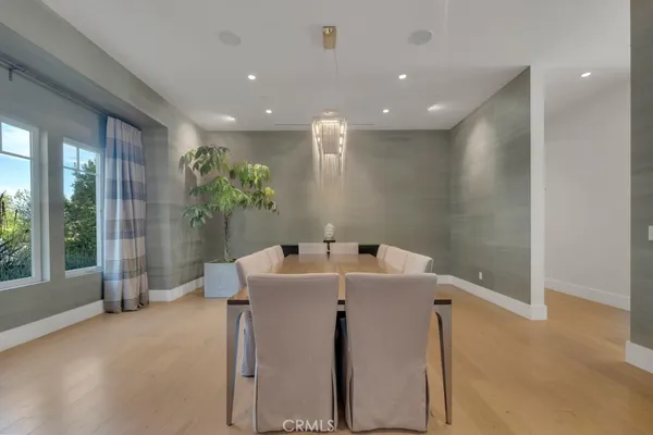 a kitchen with a table and chairs in it