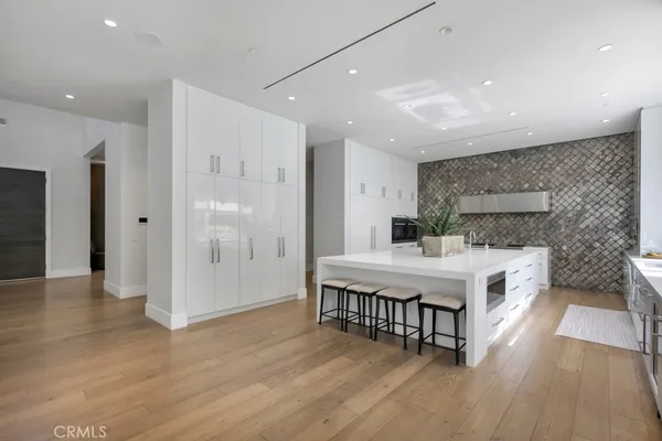 a bathroom with a toilet sink a mirror and shower