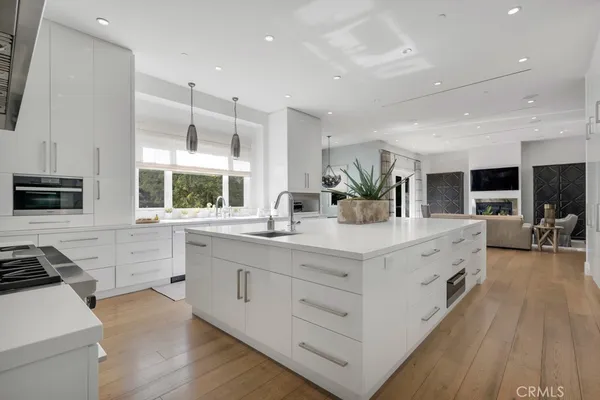 a spacious bathroom with a double vanity sink a mirror and a shower