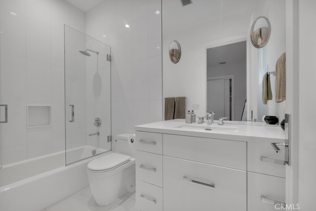 17950 Rancho Street Encino, CA 91316 - Photo 29 of 75 a bathroom with a sink a toilet and shower