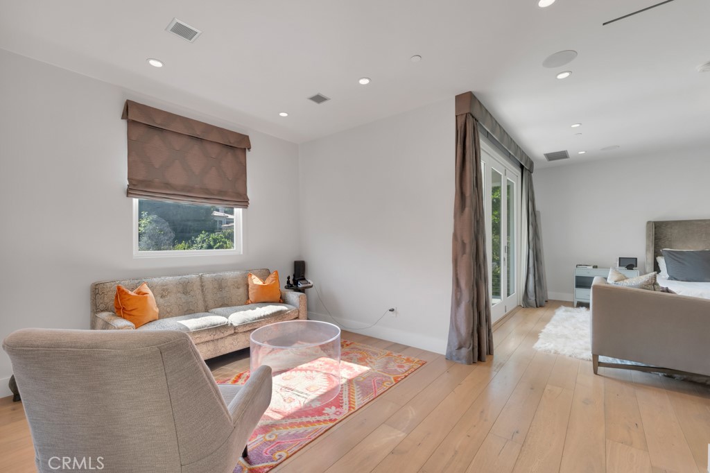 17950 Rancho Street Encino, CA 91316 - Photo 32 of 75 a living room with furniture and a window