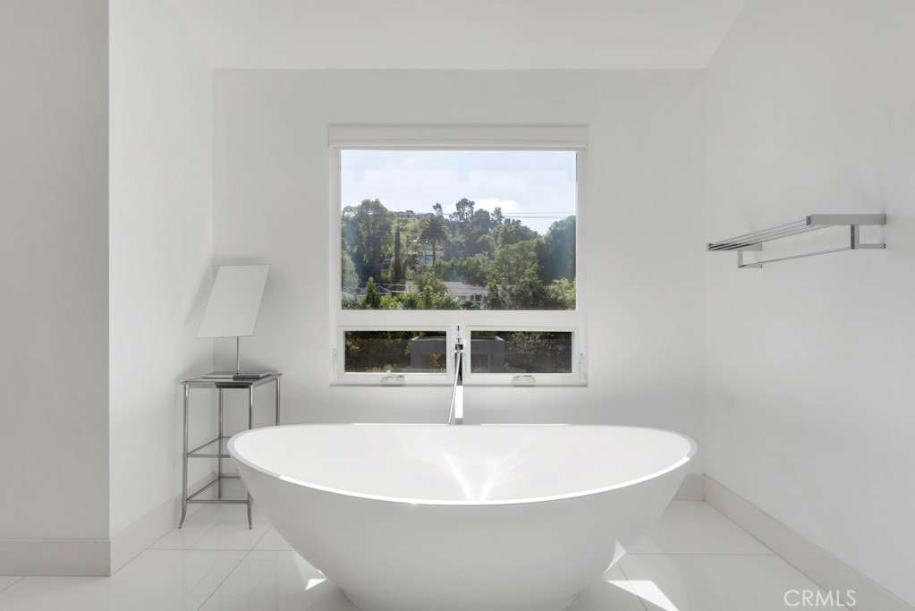 17950 Rancho Street Encino, CA 91316 - Photo 34 of 75 a white bath tub sitting next to a window